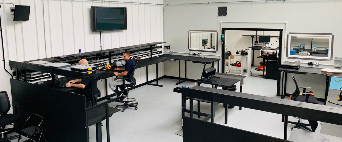 Interior shot of the newly built cable department with clear desks and white walls
