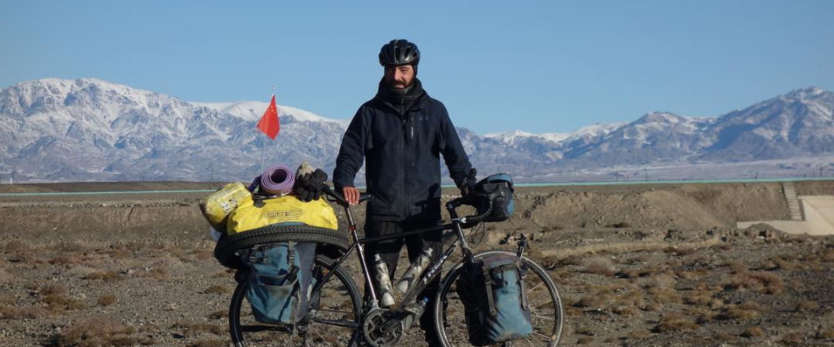 Harry standing in front of the Himalayas