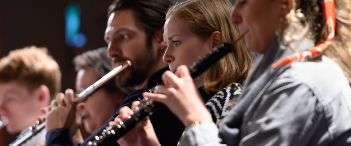 Woodwinds warming up before beginning a concert