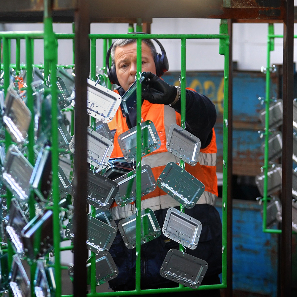 Man inspecting case handles
