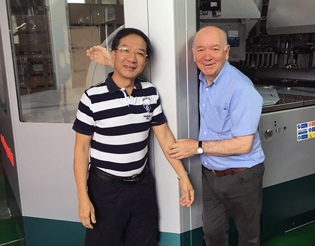 Roger and Stanley standing in front of our new machine