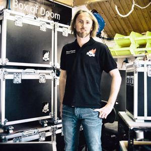 Sylvester standing in front of flight case