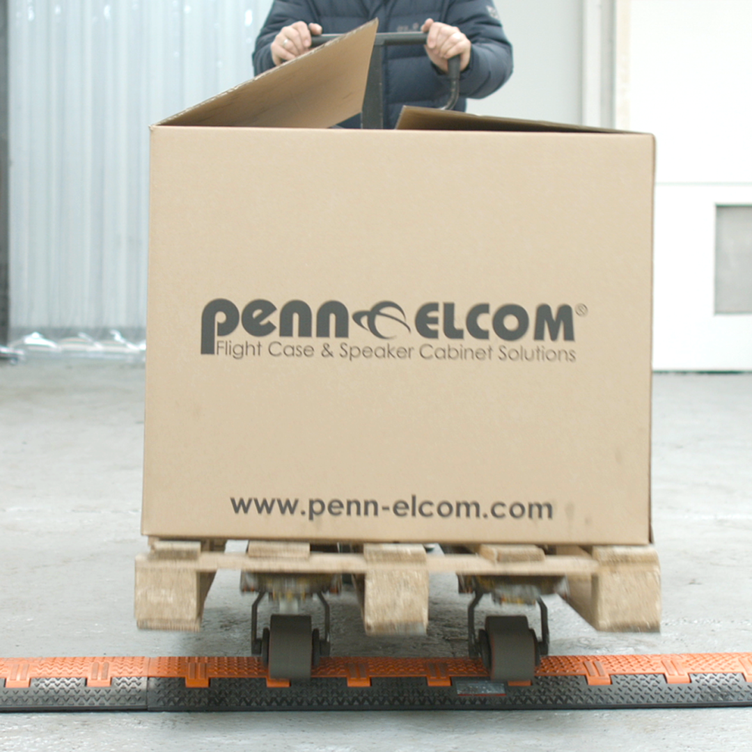 Box with Penn Elcom logo being pushed on trolley