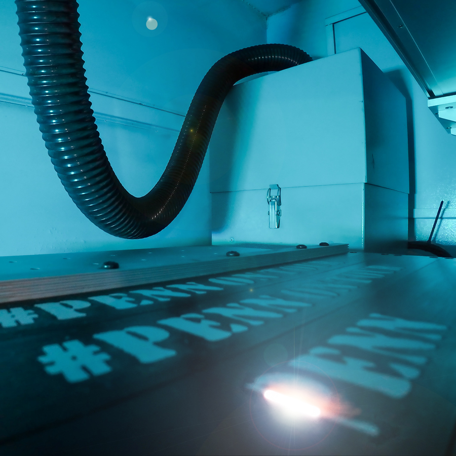 Penn Elcom logo being laser etched on panel 