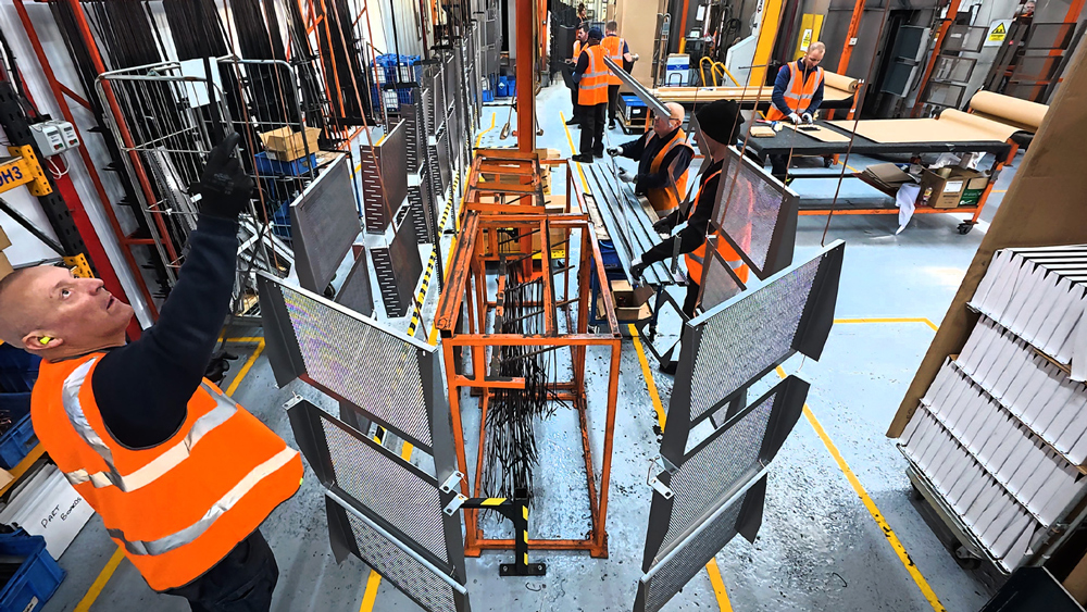 Penn Elcom paint line in Washington with people adding items to the line