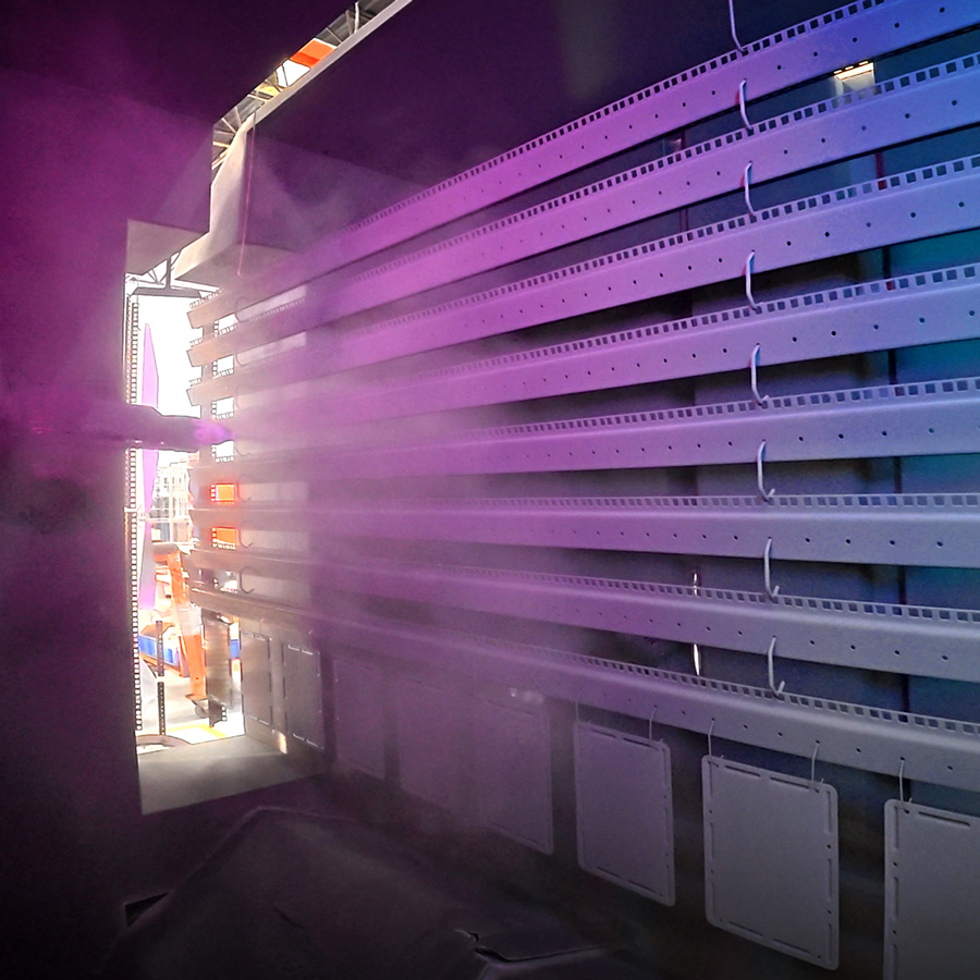 interior shot of our extensive paint line showing 19 inch racking products being sprayed